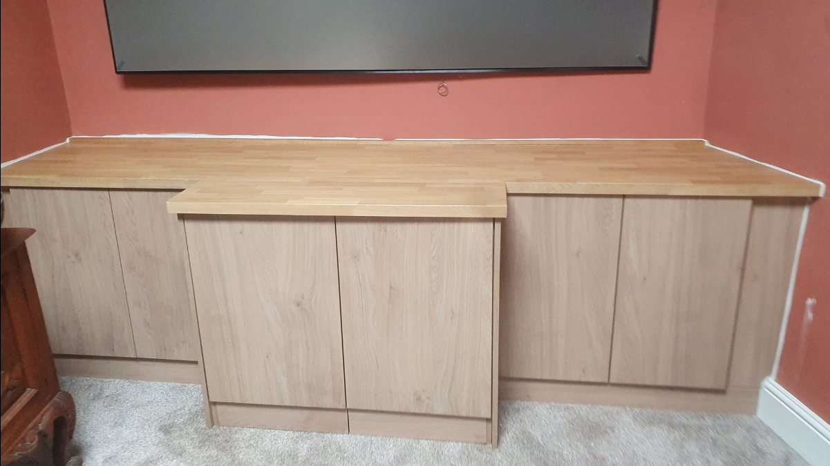 Full view of oak media unit showing cabinet doors